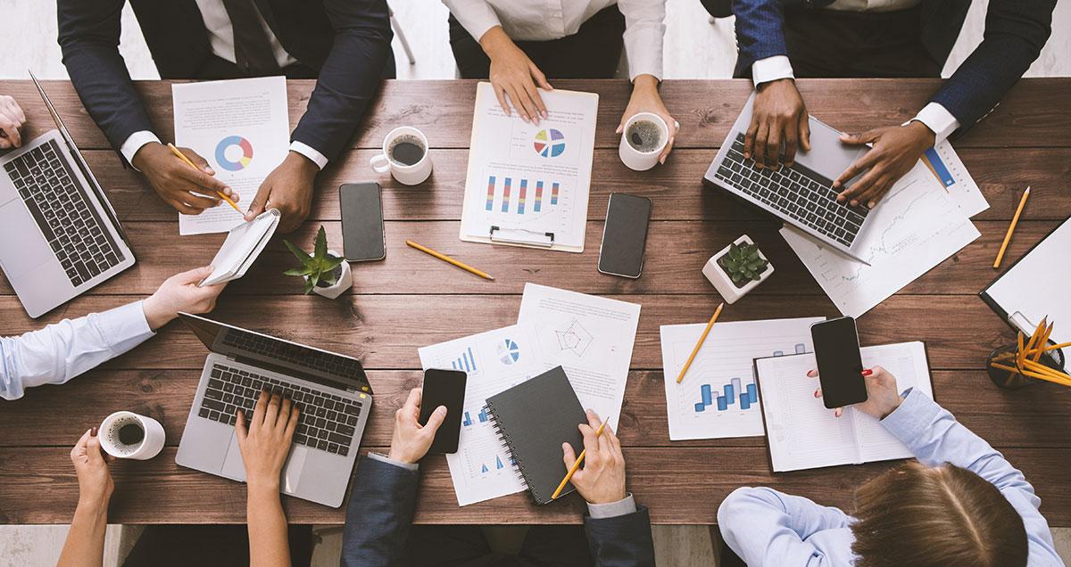 Meeting-of-business-team-working-with-gadgets-and-documents